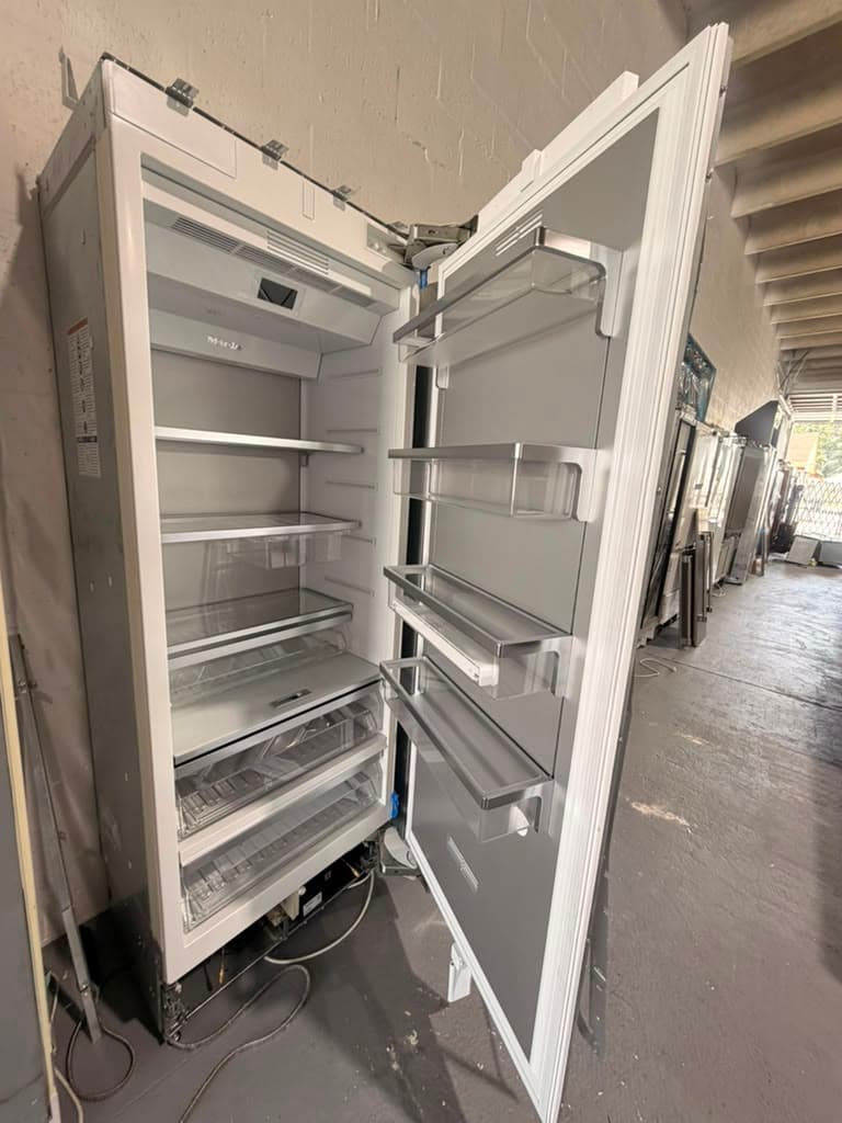 Actual Miele K 2802 Vi refrigerator column open with shelves and bins visible