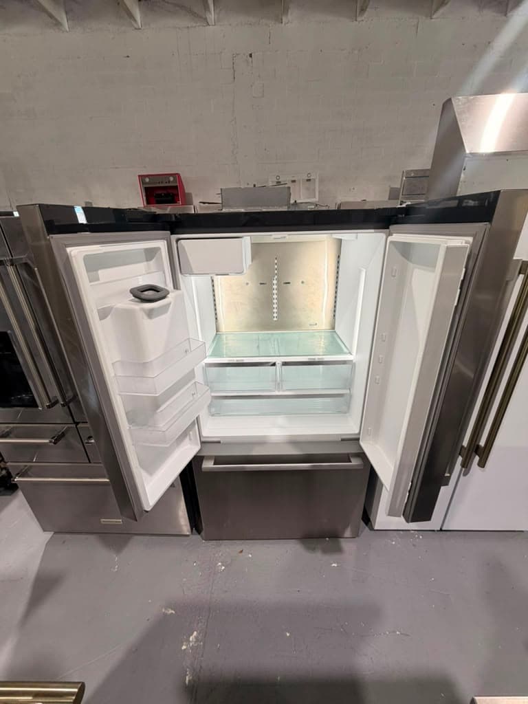 Actual Bosch refrigerator open showing missing interior shelves