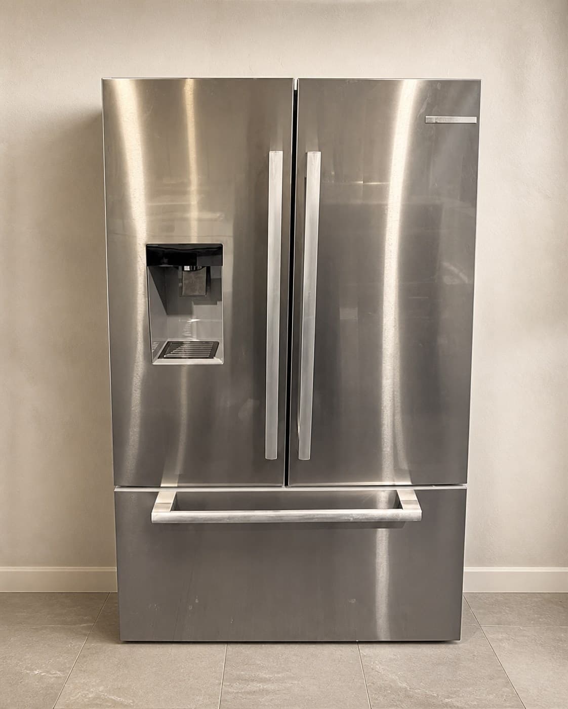 Actual Bosch stainless steel French-door refrigerator photographed closed in the showroom
