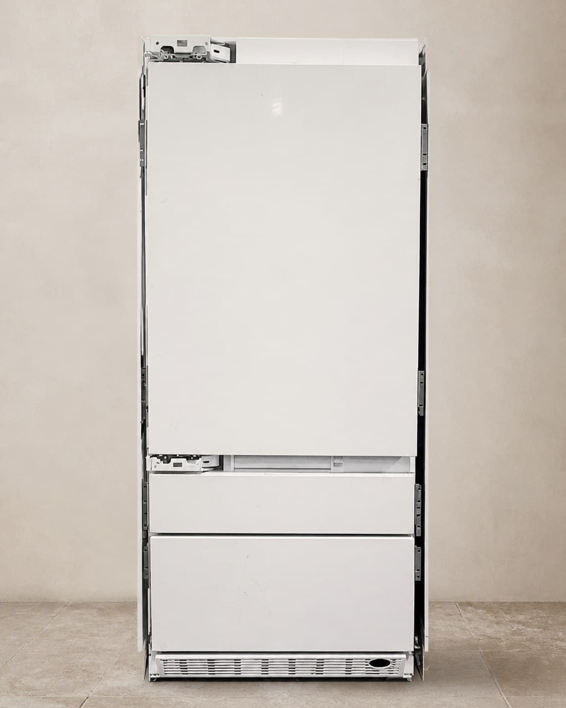 Actual Monogram panel-ready integrated refrigerator photographed closed in the showroom