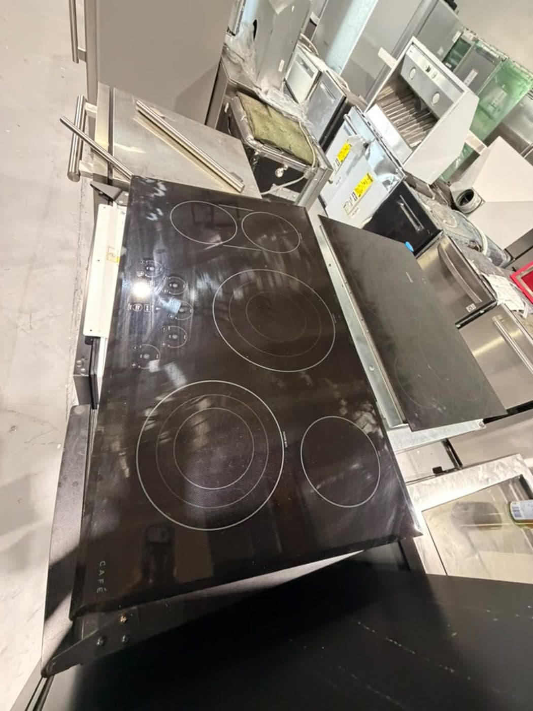 Actual café 36-inch electric cooktop photographed in Oakland Park — actual unit · top overview