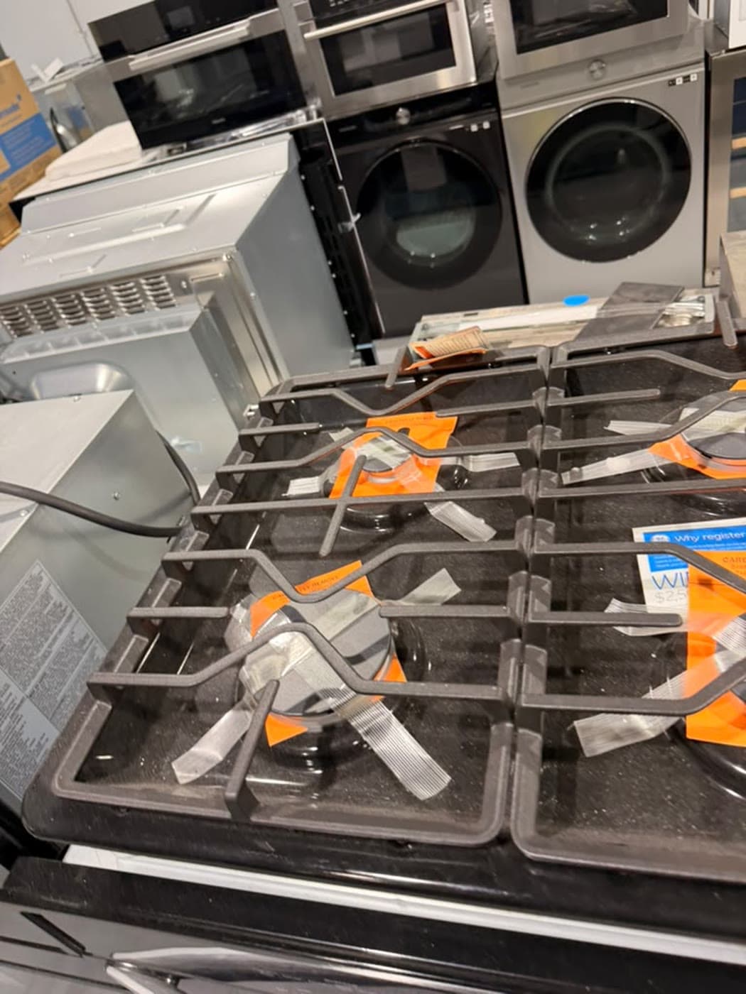 Actual ge 30-inch gas cooktop photographed in Oakland Park — actual unit · grate and control detail