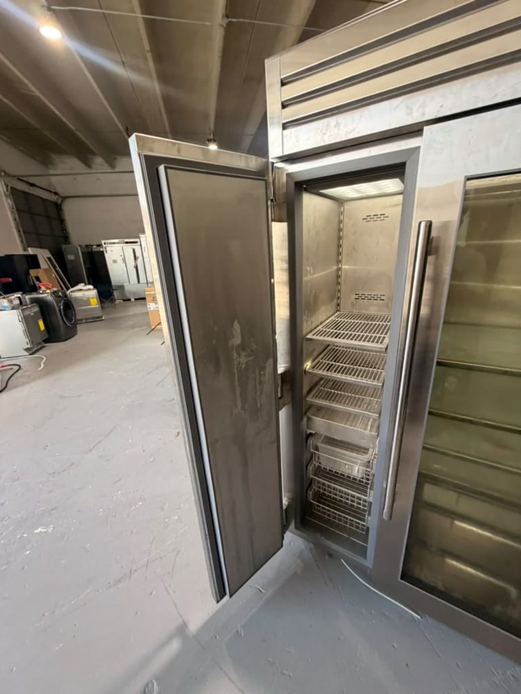 Actual true residential 48-inch refrigerator photographed in Oakland Park — additional actual-unit freezer interior view.