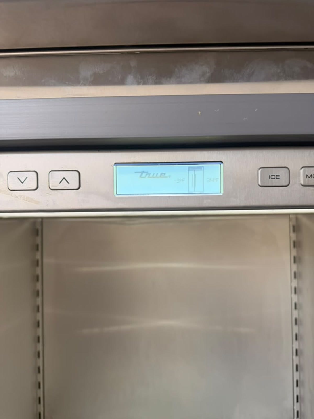 Actual true residential 48-inch refrigerator photographed in Oakland Park — actual-unit temperature controls and interior detail.