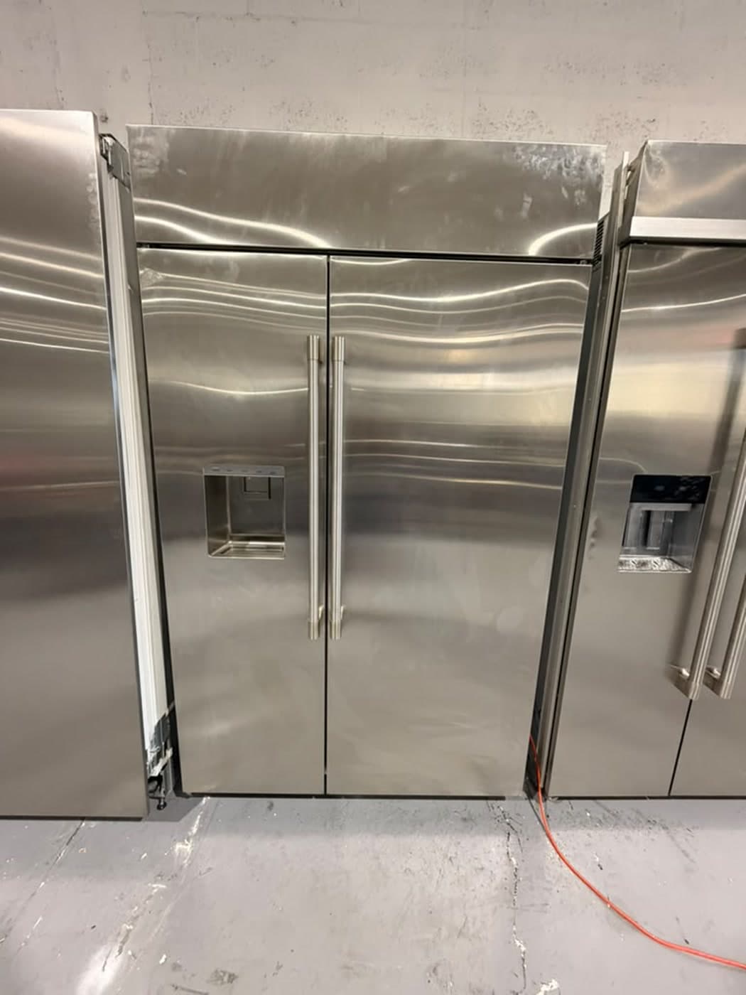 Actual monogram 48-inch side-by-side refrigerator photographed in Oakland Park — front exterior of the actual unit