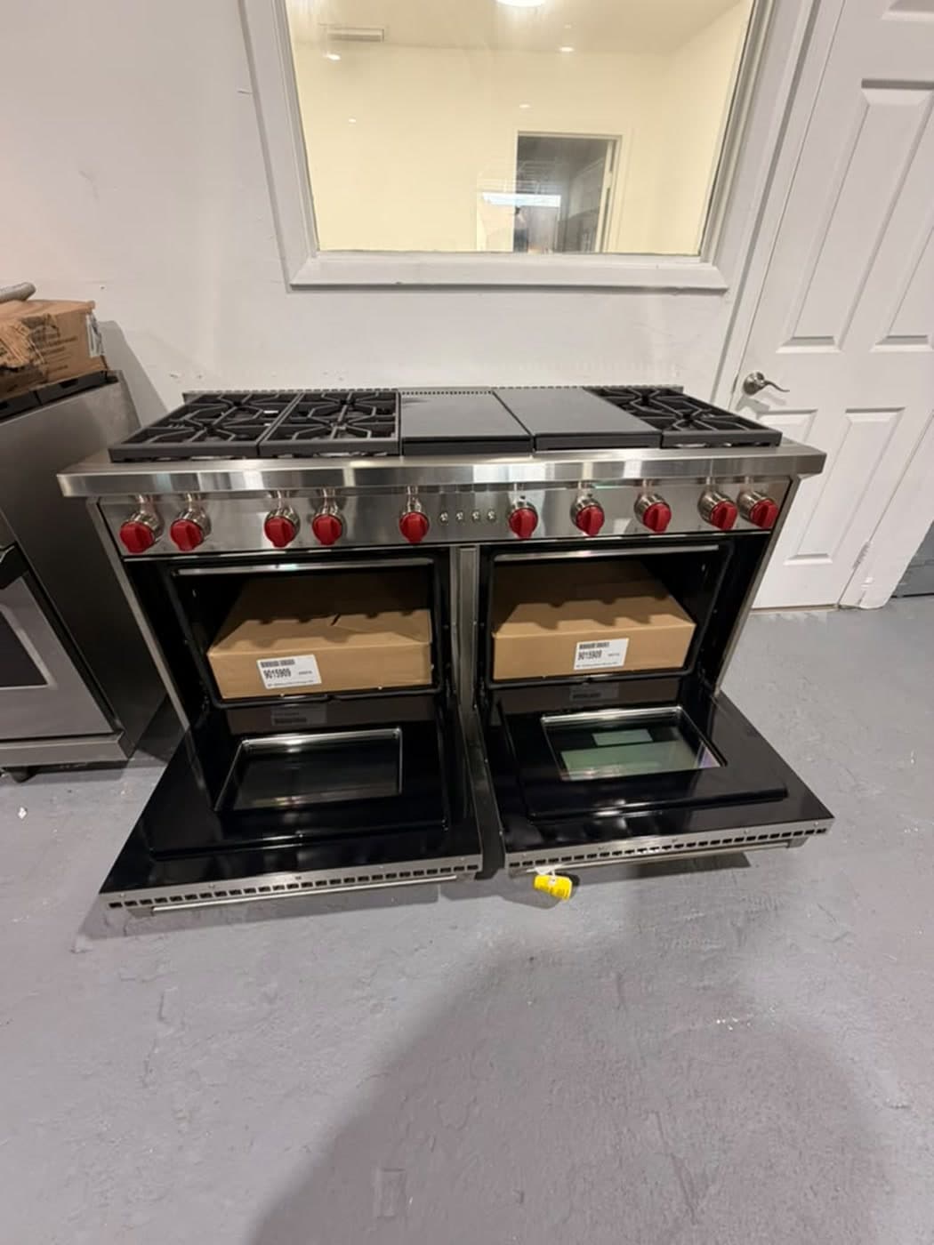 Actual wolf 60-inch professional gas range photographed in Oakland Park — actual wolf range · both oven doors open