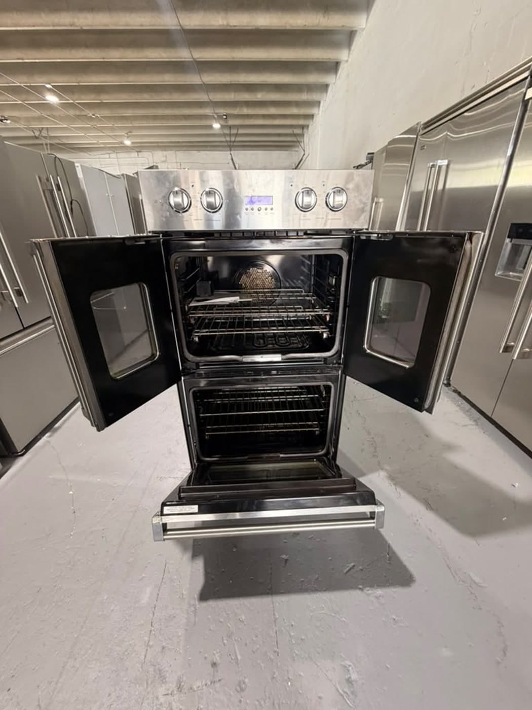 Actual viking 30-inch double wall oven photographed in Oakland Park — actual unit · french doors and lower oven open