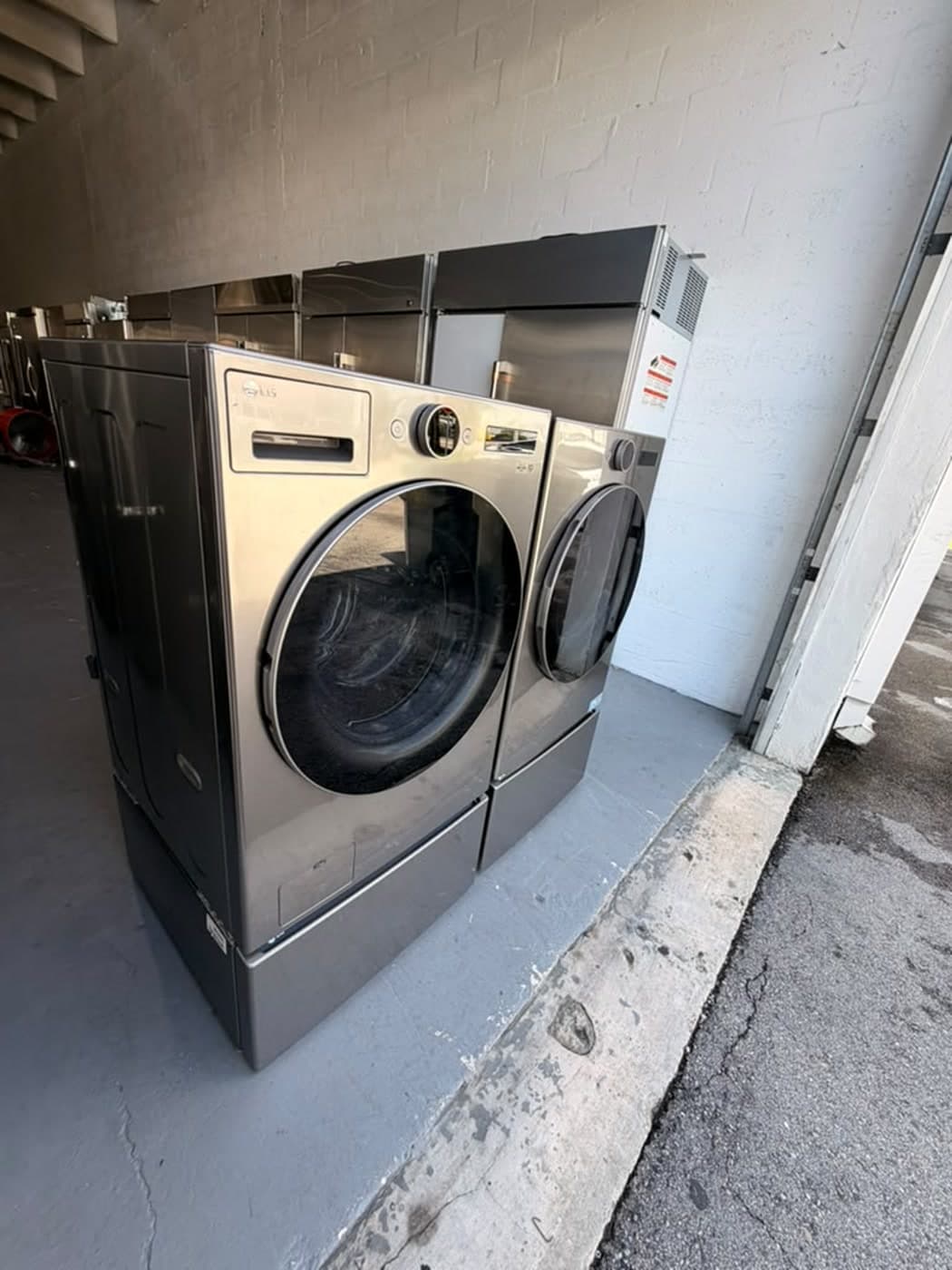 Actual lg 27-inch washer and dryer set photographed in Oakland Park — actual set · alternate front angle