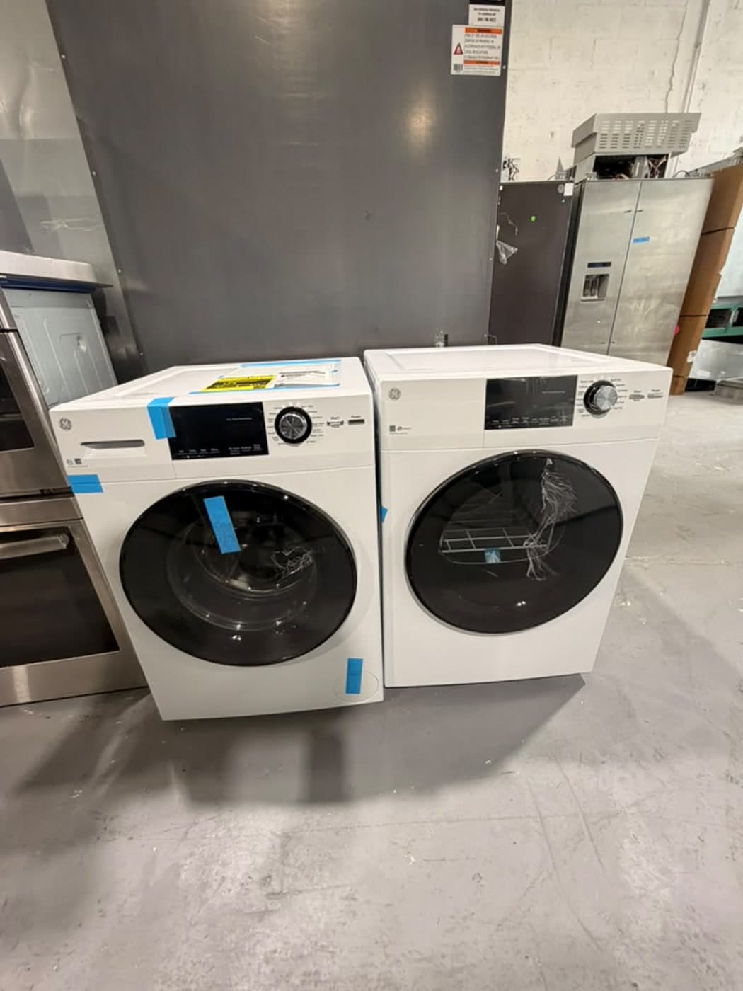 Actual ge 24-inch washer and dryer set photographed in Oakland Park — actual set · closed front overview