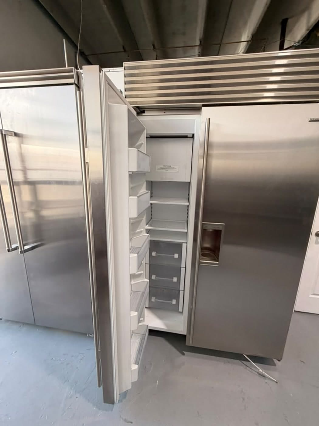 Actual sub-zero 48-inch side-by-side refrigerator photographed in Oakland Park — actual unit · shelving and bin detail