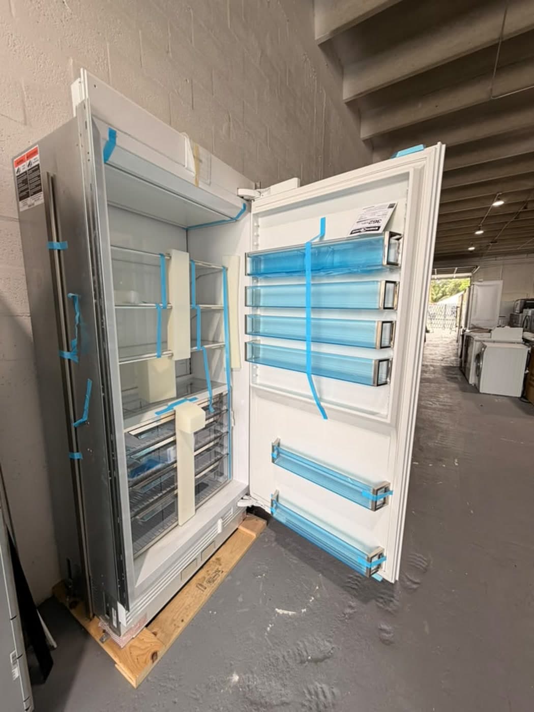 Actual sub-zero 36-inch refrigerator column photographed in Oakland Park — actual unit · open front overview