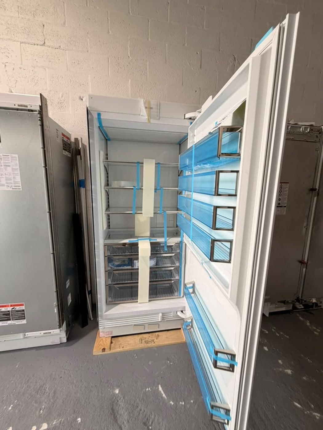 Actual sub-zero 36-inch refrigerator column photographed in Oakland Park — actual unit · alternate open front