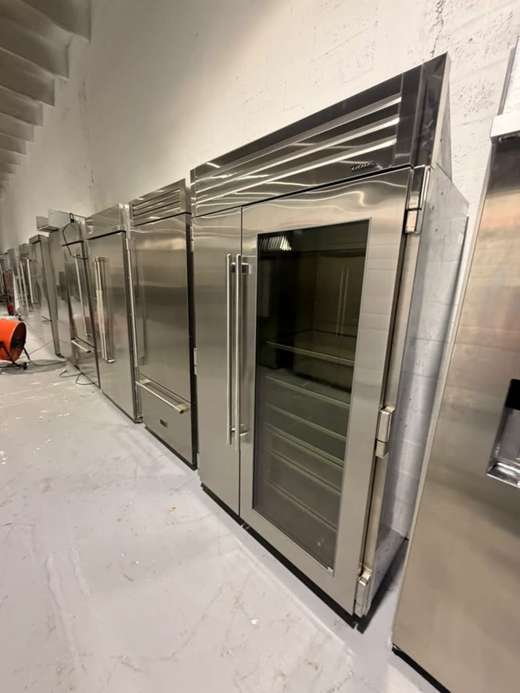 Actual true residential 48-inch glass-door refrigerator photographed in Oakland Park — actual unit · closed front angle