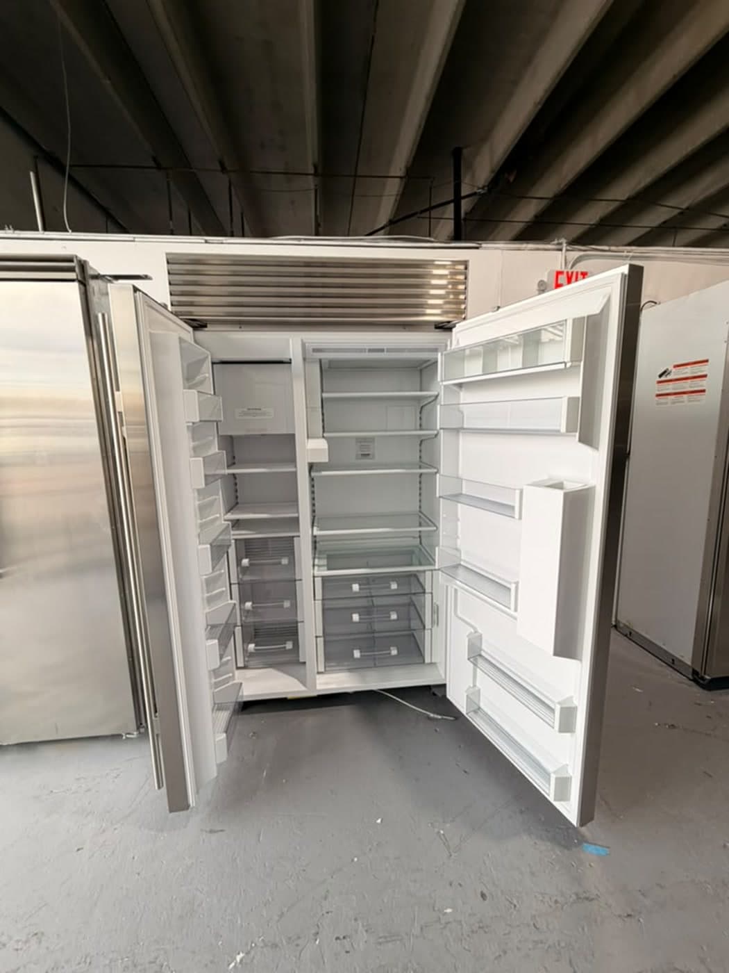 Actual sub-zero 48-inch side-by-side refrigerator with dispenser photographed in Oakland Park — actual unit · both doors open