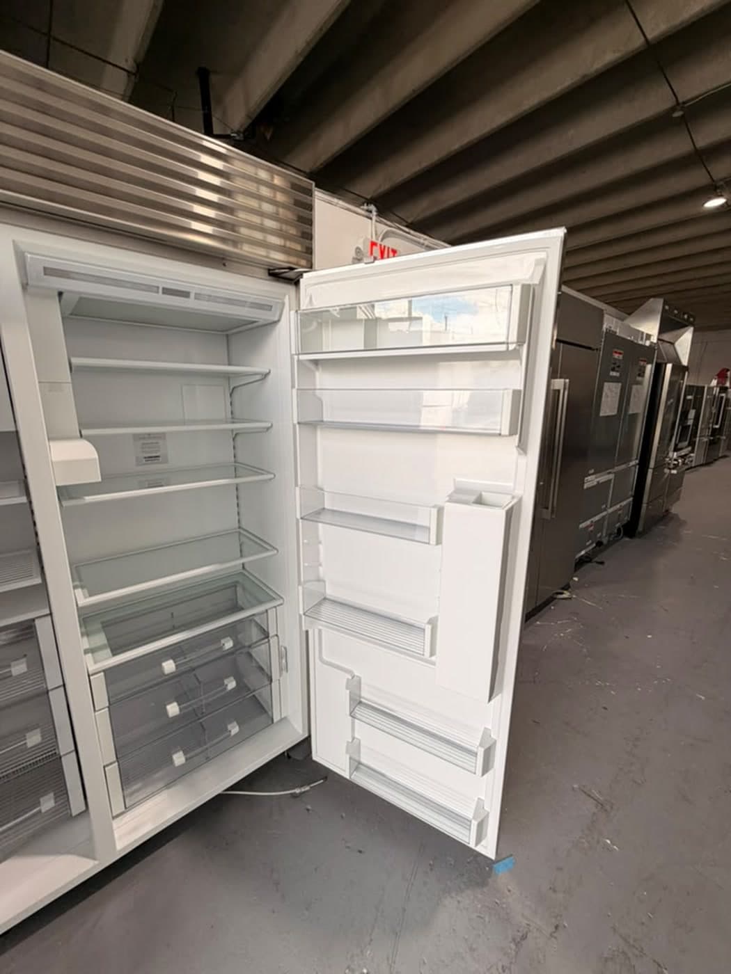 Actual sub-zero 48-inch side-by-side refrigerator with dispenser photographed in Oakland Park — actual unit · open interior angle