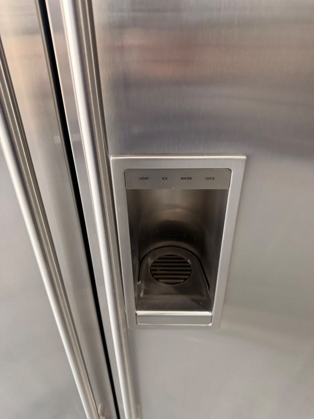 Actual sub-zero 48-inch side-by-side refrigerator with dispenser photographed in Oakland Park — actual unit · dispenser detail