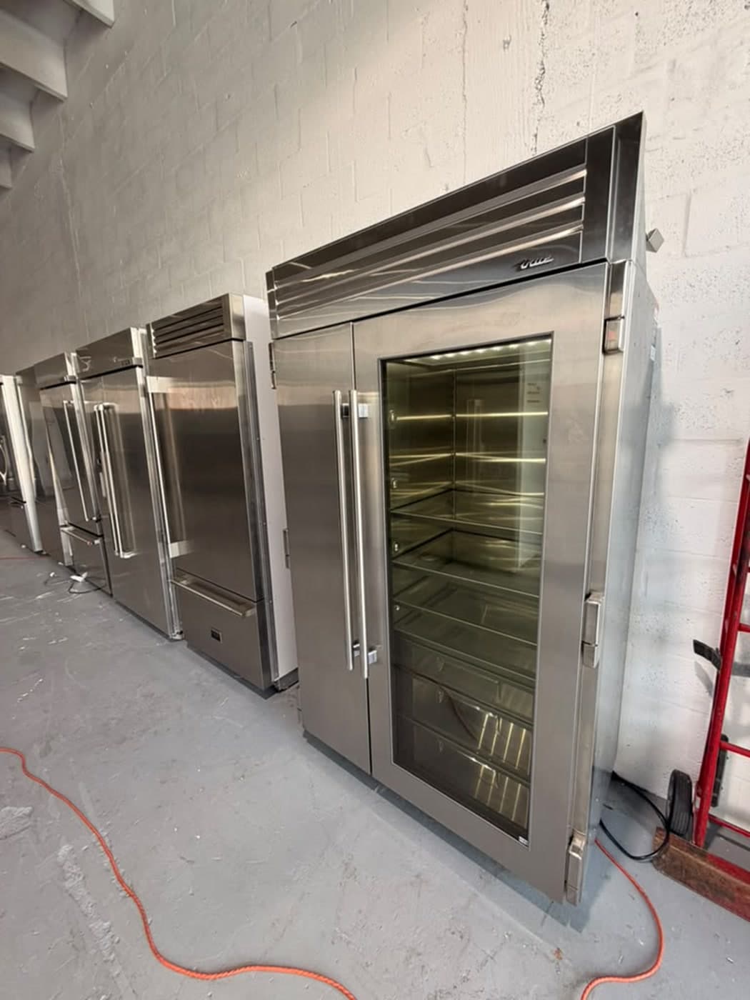 Actual true residential 48-inch refrigerator with glass door photographed in Oakland Park — actual unit · alternate closed angle