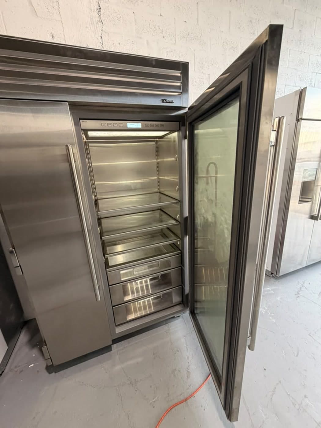 Actual true residential 48-inch refrigerator with glass door photographed in Oakland Park — actual unit · glass door open