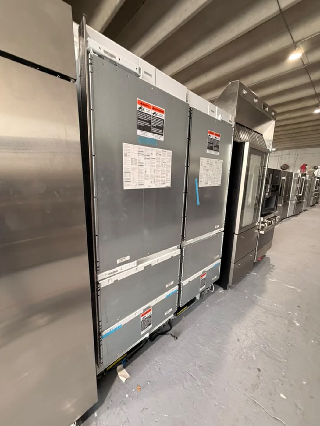Actual sub-zero panel-ready bottom-freezer pair photographed in Oakland Park — actual units · closed side angle