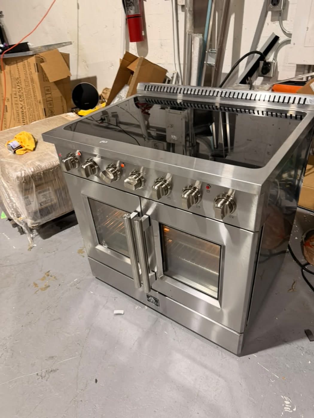 Actual forno 36-inch electric french-door range photographed in Oakland Park — actual unit · closed side angle