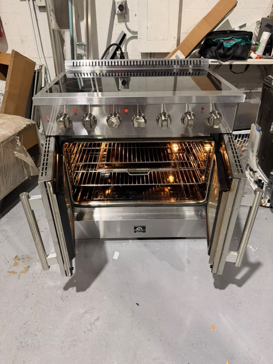 Actual forno 36-inch electric french-door range photographed in Oakland Park — actual unit · french doors open